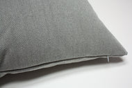 Gray textured pillow on a white background