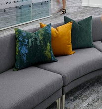 Load image into Gallery viewer, Gray sofa with colorful cushions including green, yellow, and blue on a office.