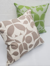 Load image into Gallery viewer, Two patterned pillows, one green and one brown, on a white surface.
