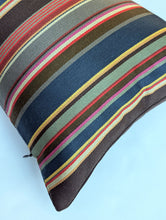 Load image into Gallery viewer, Striped pillow with multicolor pattern on a light blue background