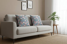 Load image into Gallery viewer, Decorative pillow with a colorful flower pattern on a white background