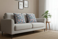 Decorative pillow with a colorful flower pattern on a white background